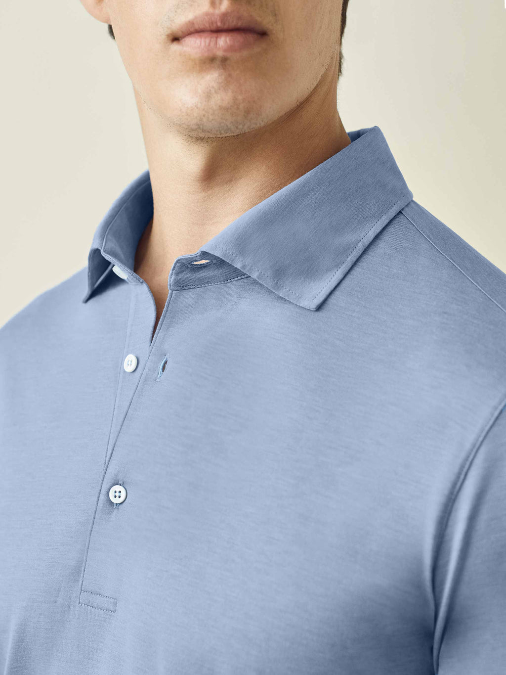 Close-up of the collar and placket detail on the Luca Faloni Amalfi Silk-Cotton Polo Shirt in light blue.
