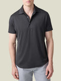 Front view of a man wearing a charcoal grey silk-cotton short-sleeved polo shirt by Luca Faloni.