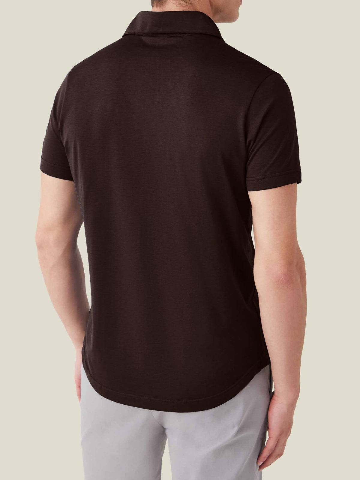 Back view of a model wearing the Luca Faloni Short-sleeved Silk Cotton Polo in chocolate brown.