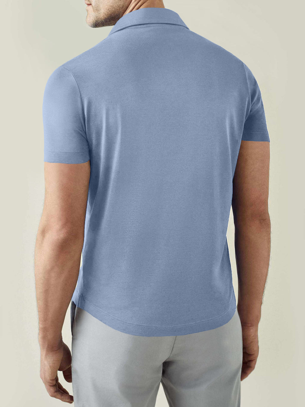 Back view of the Luca Faloni Short-sleeved Silk Cotton Polo in light blue, worn by a model.