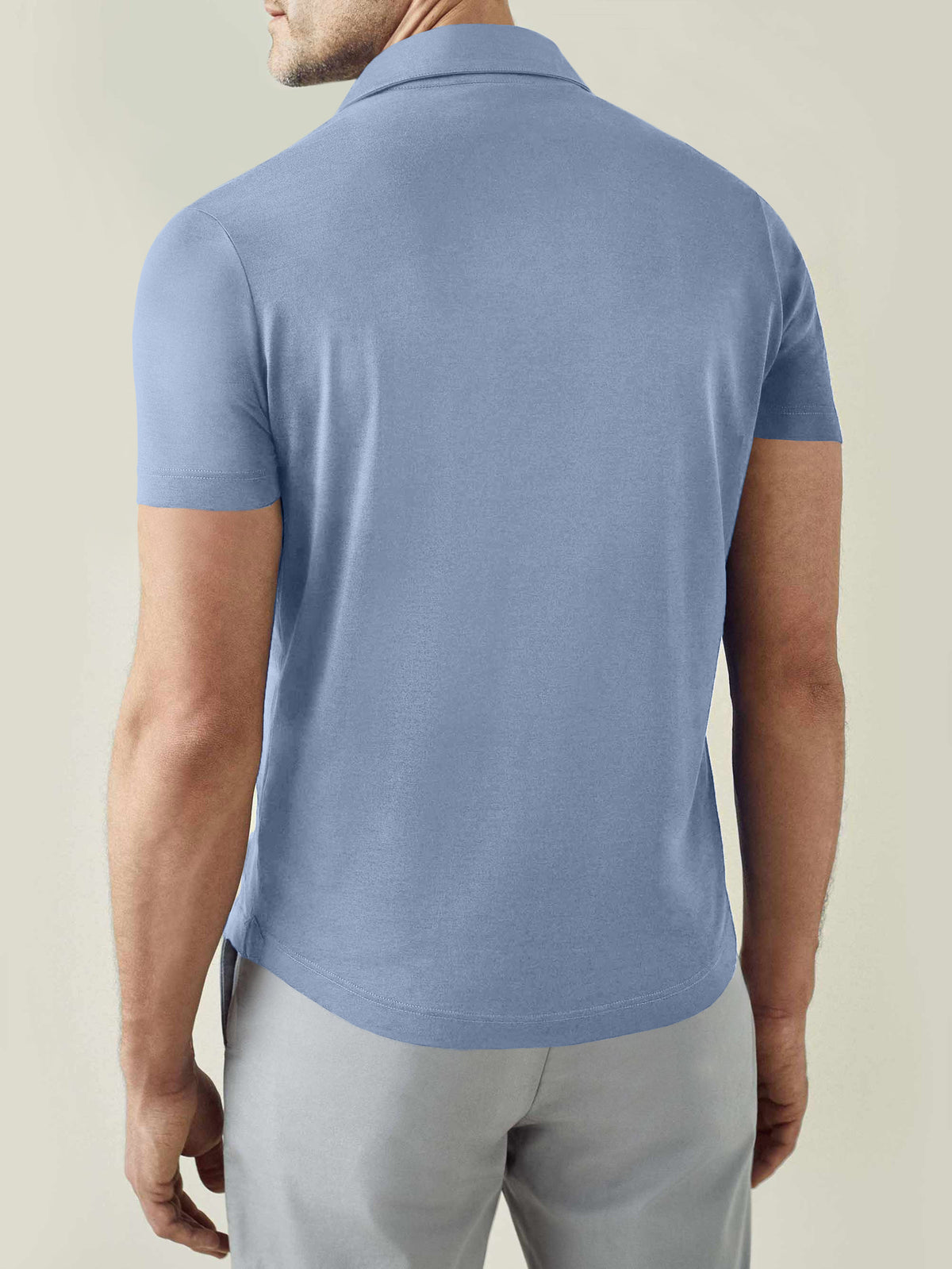 Back view of the Luca Faloni Short-sleeved Silk Cotton Polo in light blue, worn by a model.