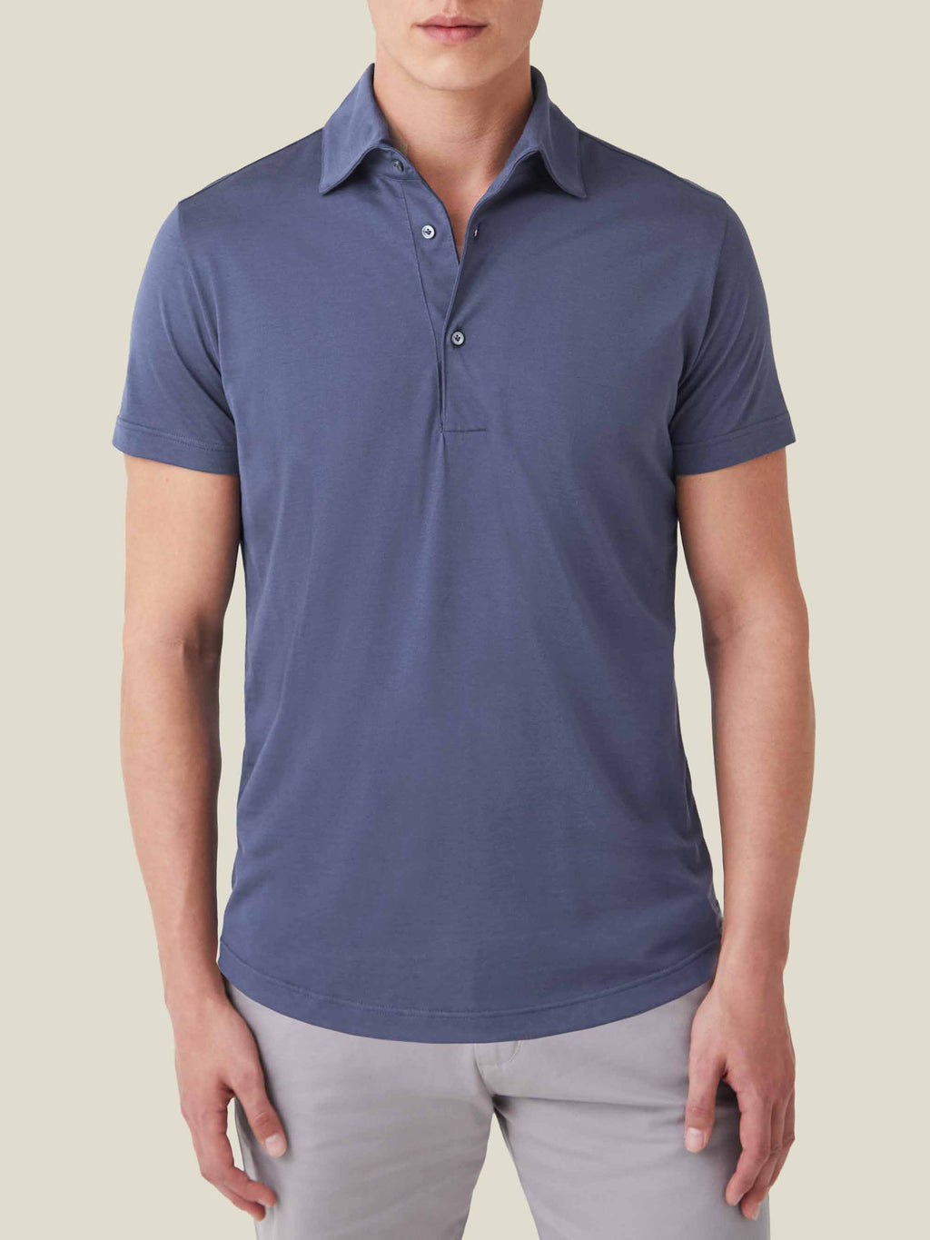 Front view of a man wearing the Ocean Blue Short-Sleeved Silk-Cotton Polo.