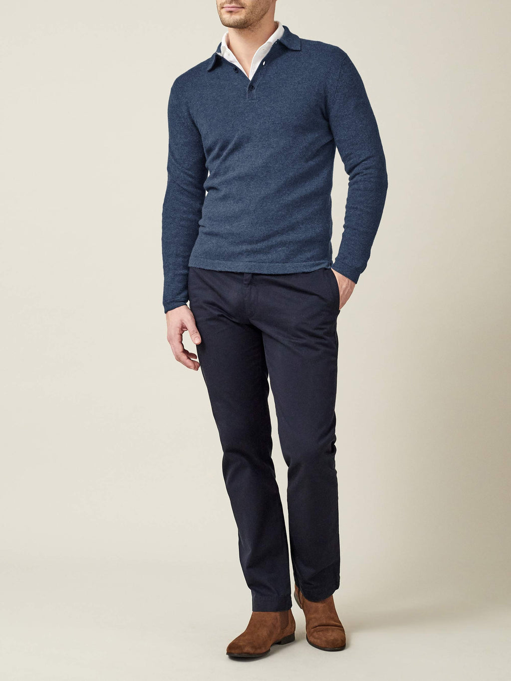 Model wearing the Atlantic Blue Cashmere Polo Sweater, styled over a white shirt and paired with dark trousers.