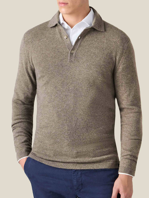 Model wears the Luca Faloni Nocciola Brown Cashmere Polo Sweater layered over a white shirt and paired with navy chinos.