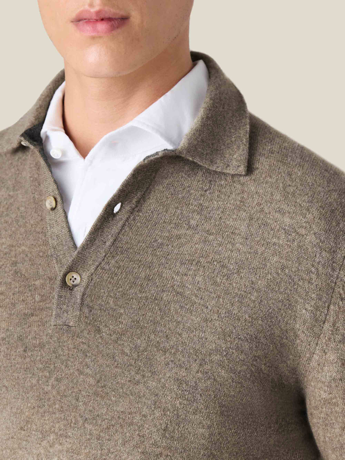 Close-up of the Nocciola Brown Cashmere Polo Sweater showing the collar and button placket layered over a white shirt.