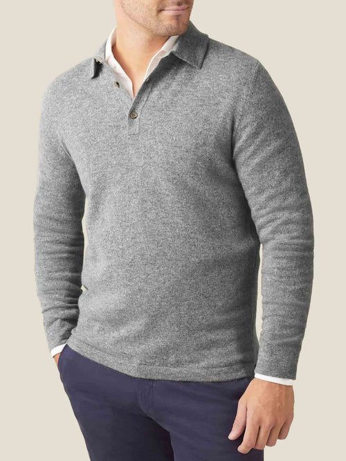 Front view of a man wearing the Dolomiti Grey Cashmere Polo Sweater layered over a white shirt.