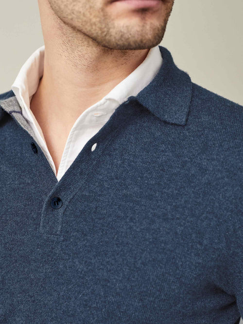 Close-up of the Atlantic Blue Cashmere Polo Sweater, styled over a white shirt to show the collar and button details.