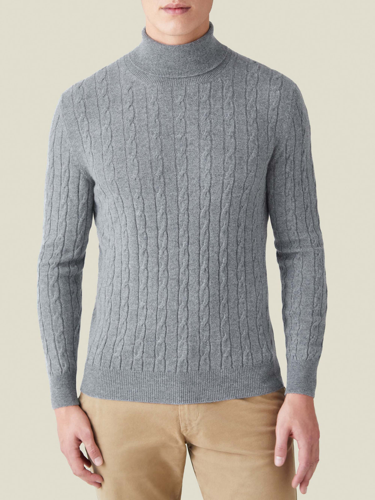 Front view of a model wearing the Dolomiti Grey Cashmere Cable Knit Roll Neck.