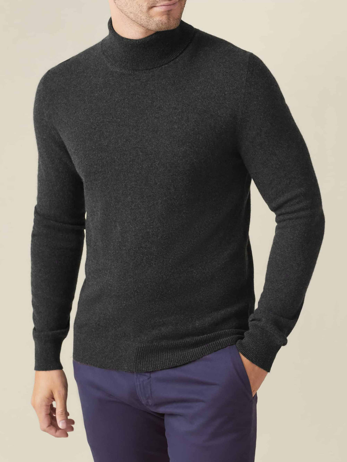 Three-quarter view of a model wearing the Luca Faloni Charcoal Grey Cashmere Roll Neck.