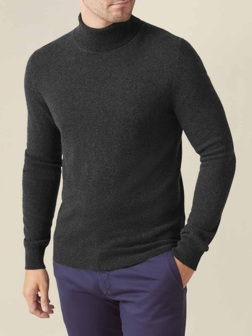 Three-quarter view of a model wearing the Luca Faloni Charcoal Grey Cashmere Roll Neck.