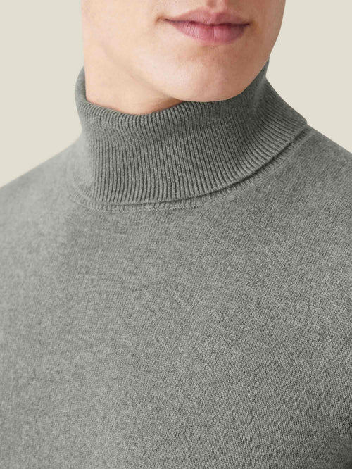 Close-up of the Luca Faloni Moss Green Cashmere Roll Neck, showcasing the soft two-ply cashmere and ribbed neckline.
