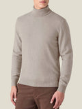Front view of a model wearing the Luca Faloni Cashmere Roll Neck in almond against a plain background.