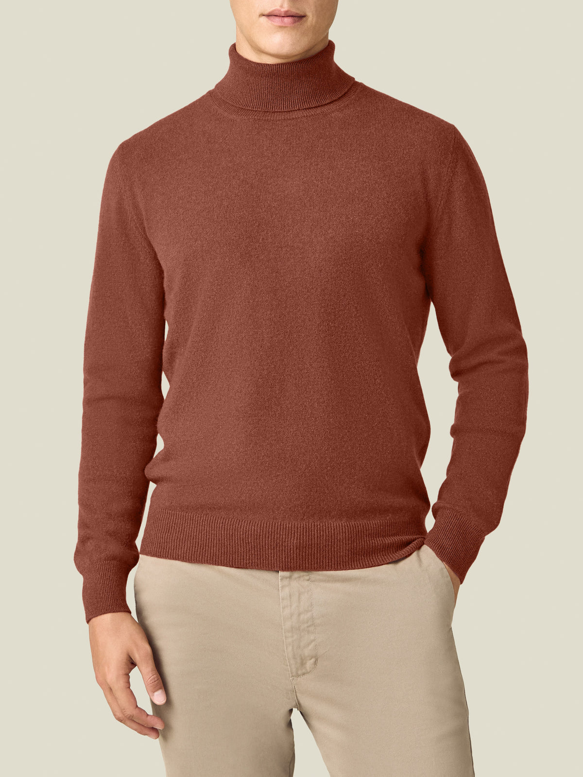 Front view of a model wearing the Luca Faloni Cashmere Roll Neck in rust.