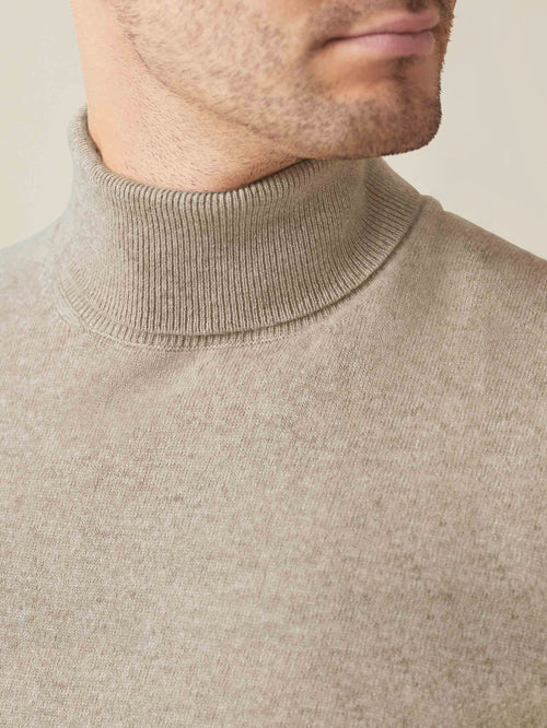 Close-up detail of the ribbed neckline on the Luca Faloni camel beige cashmere roll neck.