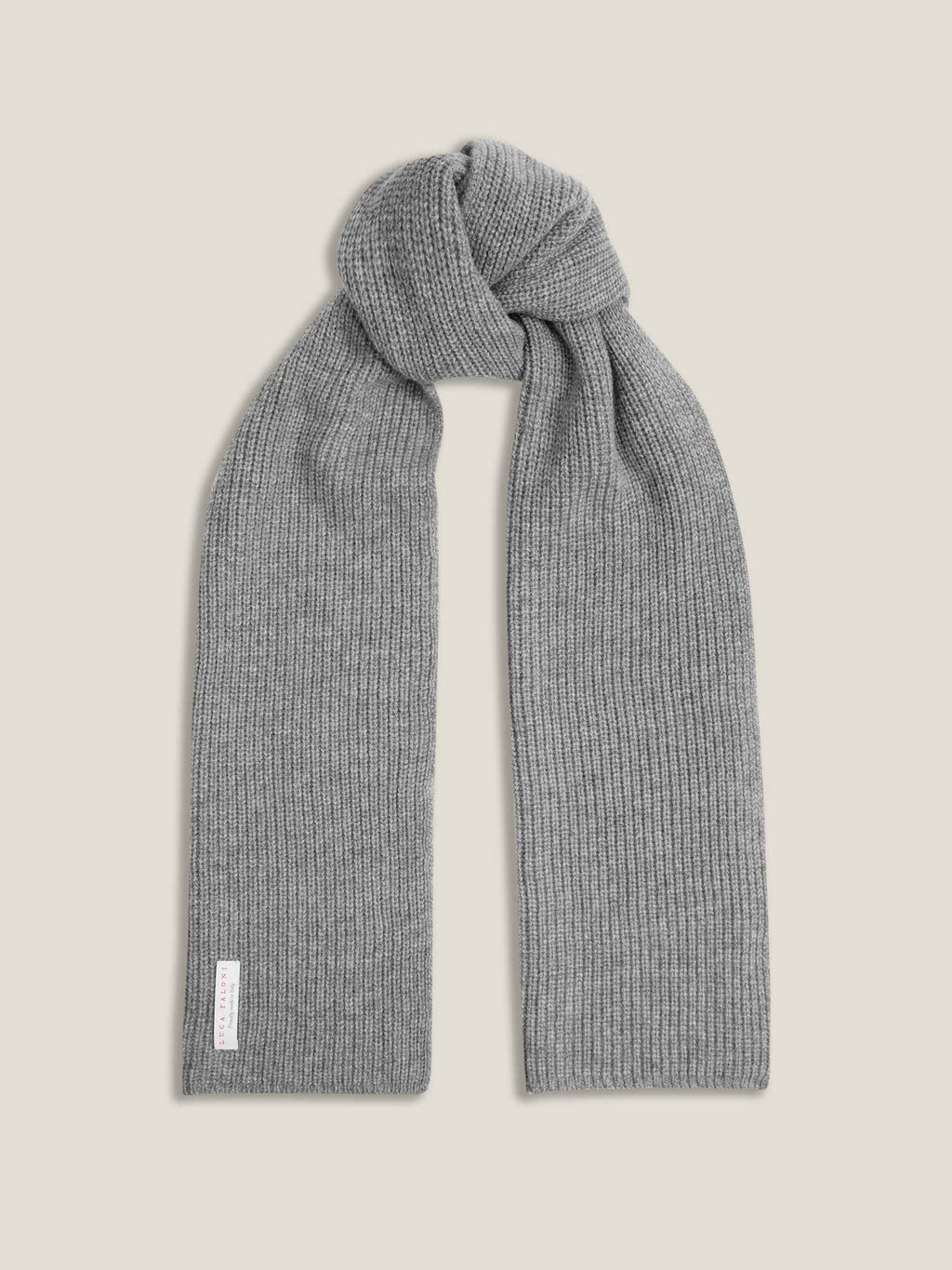 Studio shot of the Dolomiti Grey Chunky Knit Cashmere Scarf, tied and laid flat, highlighting its ribbed texture.