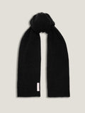 A black chunky knit cashmere scarf from Luca Faloni, tied at the top and laid flat on a light grey background.