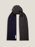 A studio shot of the Navy and Charcoal Double-Faced Cashmere Scarf, tied to display its reversible two-tone design.
