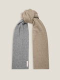 The Double-Faced Cashmere Scarf in camel and grey, shown tied in a knot to display both colours against a studio background.