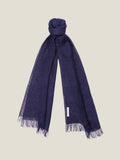 The Luca Faloni Linen Scarf in navy blue, tied at the top to highlight its lightweight linen texture and fringed ends.