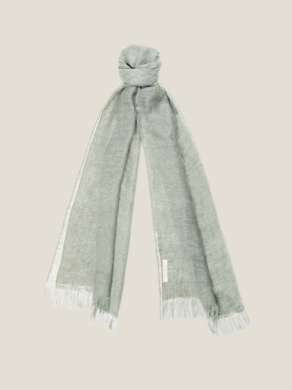 A studio shot of the Luca Faloni Linen Scarf in khaki, styled in a simple knot and showing the fringed edges.