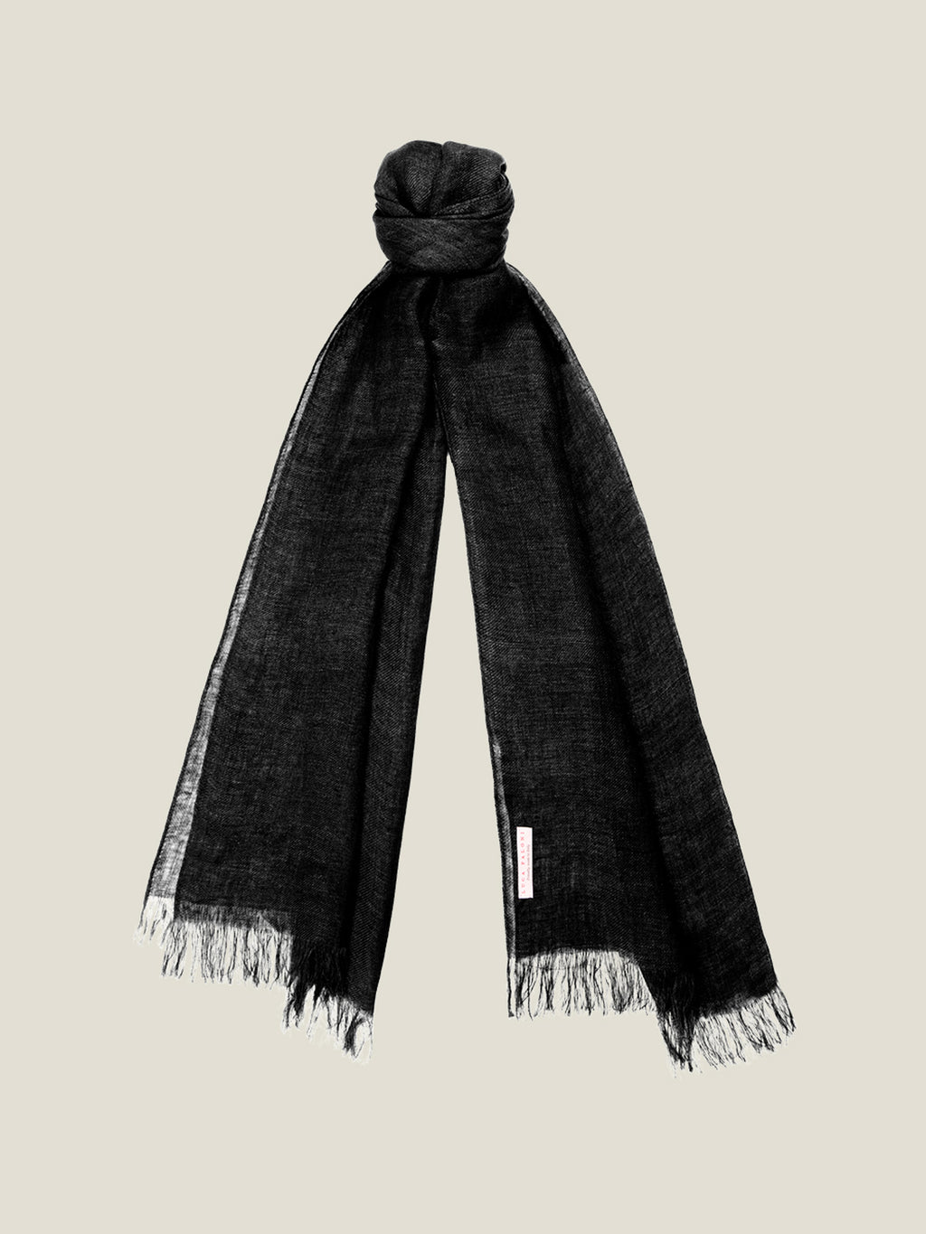 A black linen scarf with fringed ends, tied in a knot and displayed against a plain background.