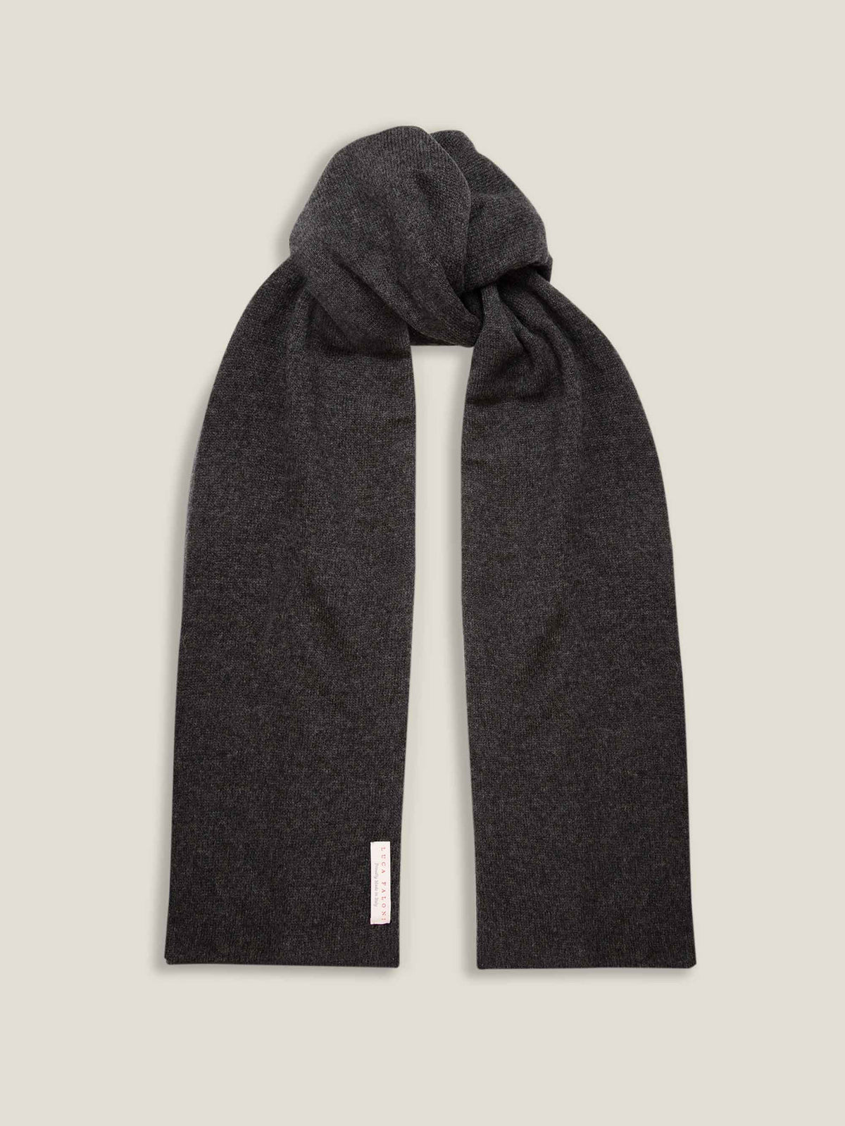 A Luca Faloni charcoal grey cashmere scarf tied in a knot and displayed on a plain background.