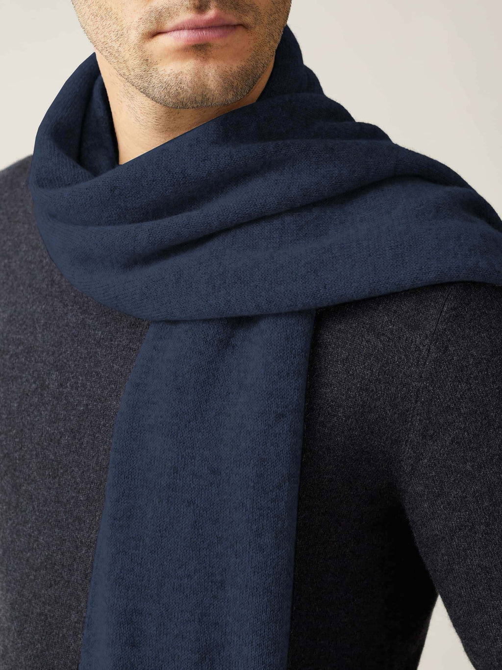 Close-up of a model wearing the Luca Faloni Cashmere Scarf in Atlantic Blue.
