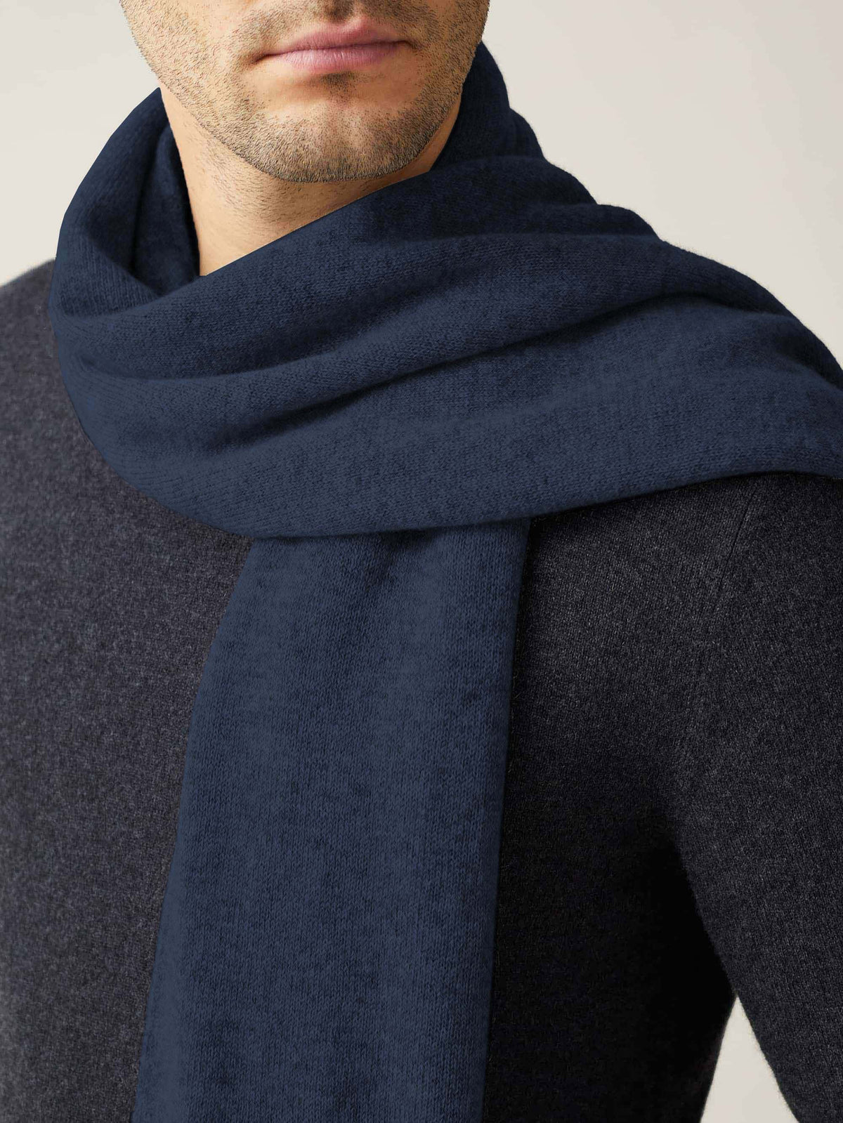 Close-up of a model wearing the Luca Faloni Cashmere Scarf in Atlantic Blue.