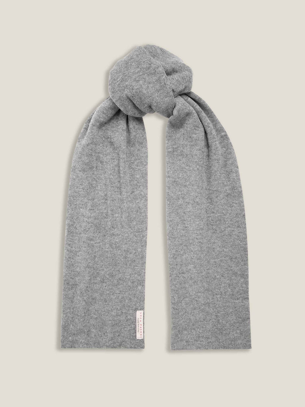 The Luca Faloni cashmere scarf in Dolomiti Grey, presented in a simple knot against a neutral background.