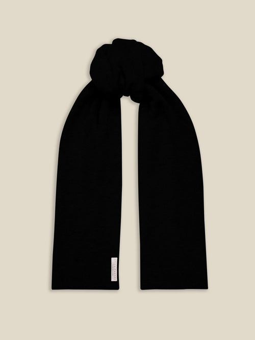 Front view of the Luca Faloni Black Cashmere Scarf, tied in a knot.