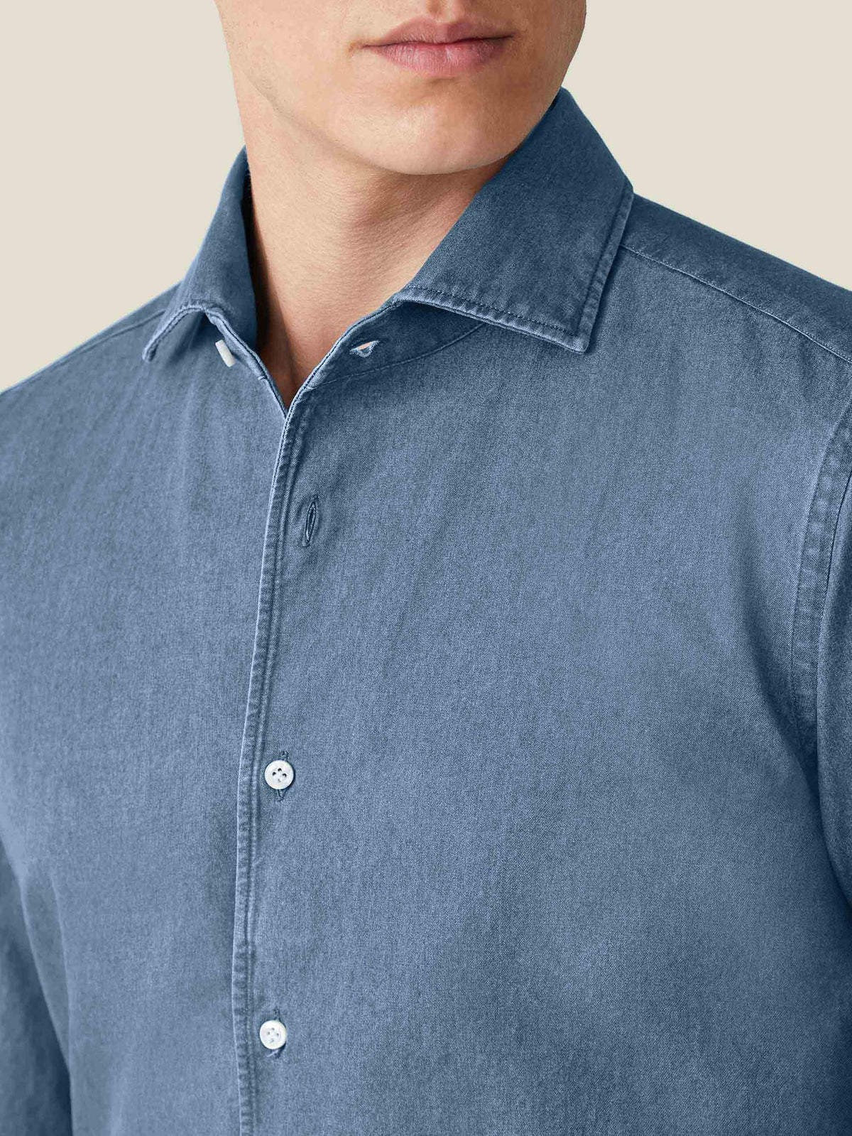 Close-up detail of the Luca Faloni Denim Shirt in classic blue, highlighting the signature Paramontura one-piece collar.