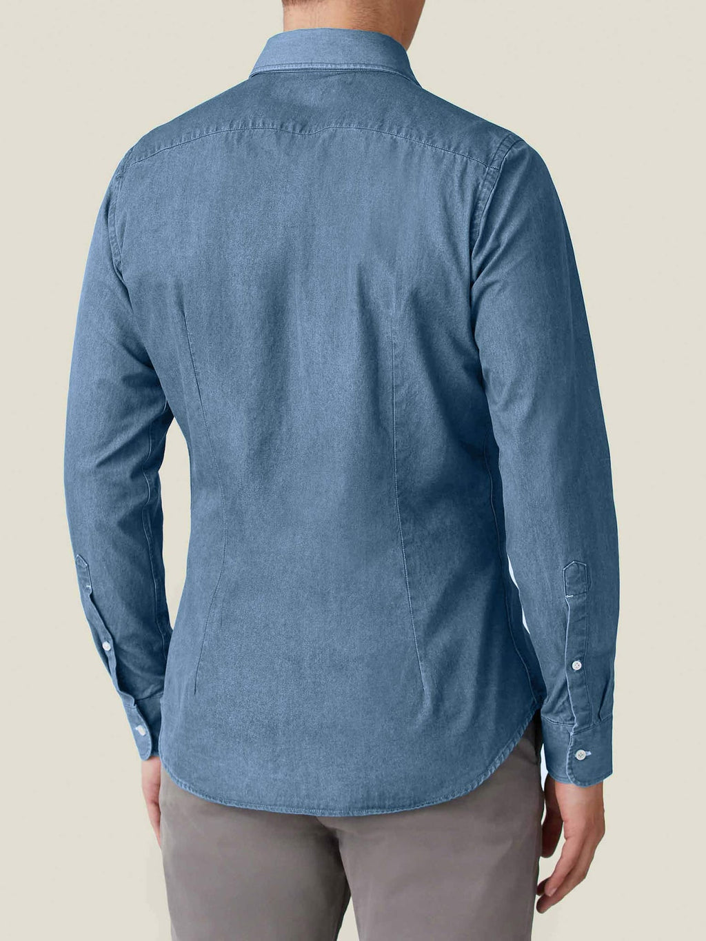 Back view of a model wearing the classic blue Denim Shirt by Luca Faloni, showing the tailored fit.