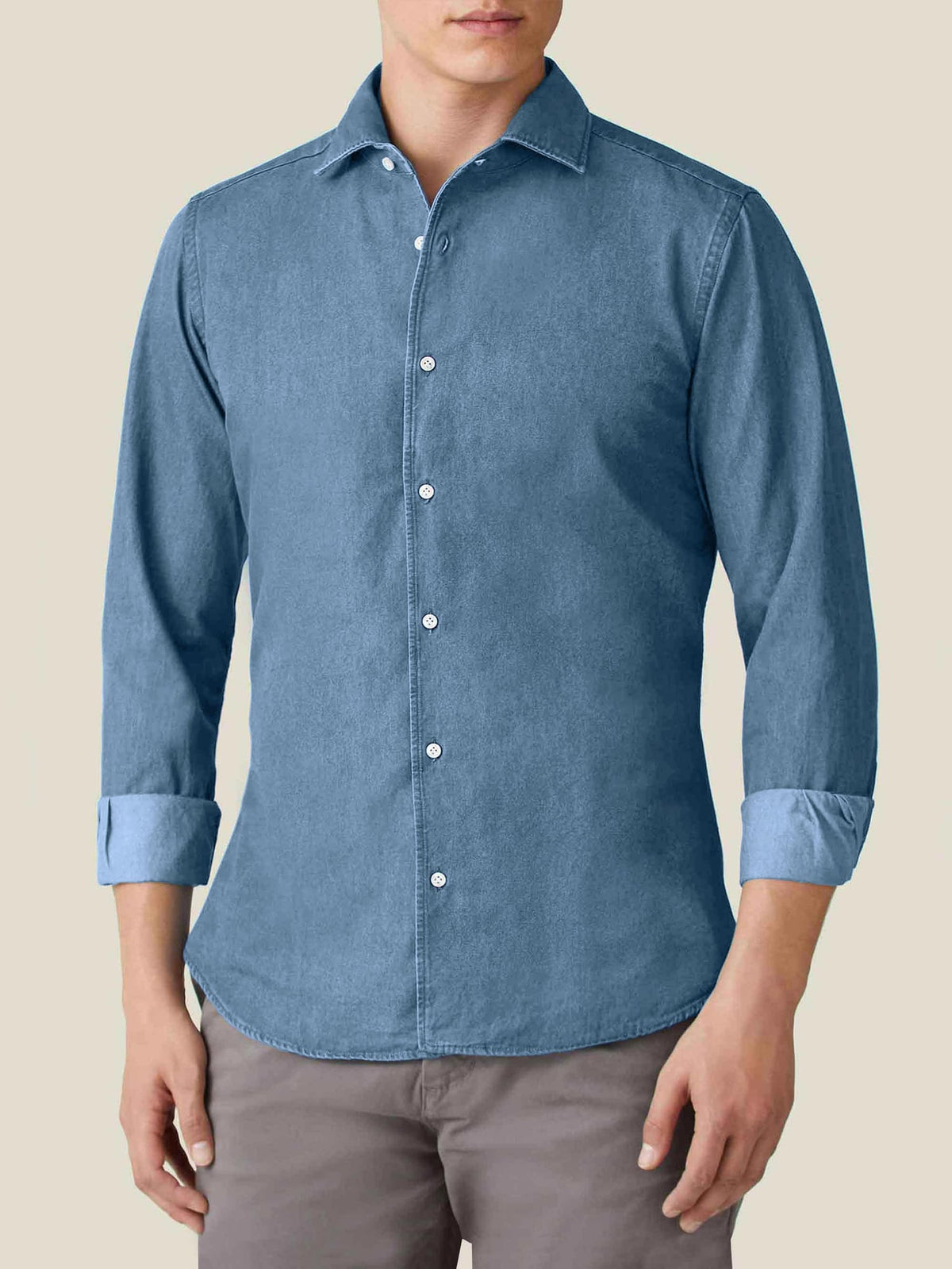 Front view of a model wearing the Luca Faloni Denim Shirt in Classic Blue with rolled-up sleeves.