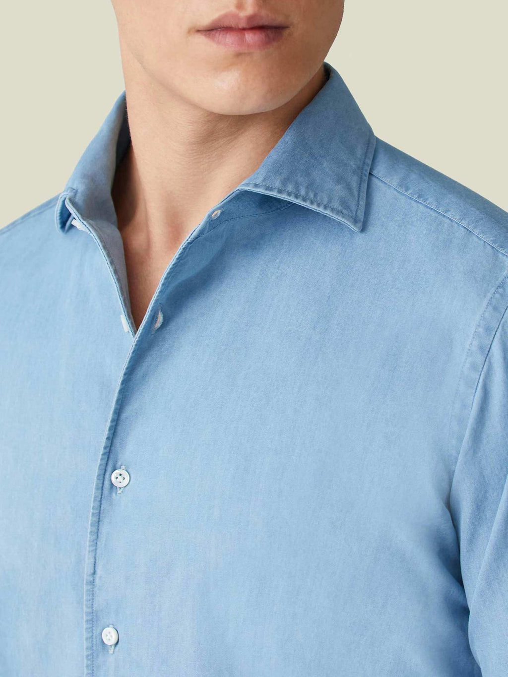 Close-up of the Luca Faloni light blue Denim Shirt, showcasing the signature one-piece Paramontura collar and fabric texture.