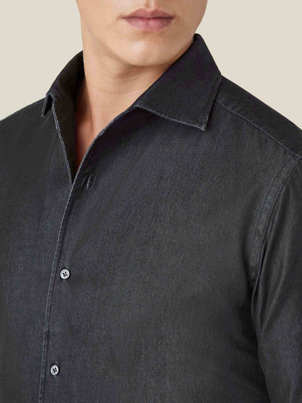 Close-up detail of the Luca Faloni Black Denim Shirt, showing the signature one-piece collar and soft denim texture.