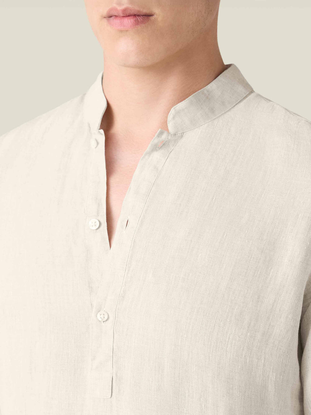 Close-up of the Forte Linen Shirt in sand, detailing the band collar, three-button placket, and pure linen fabric.