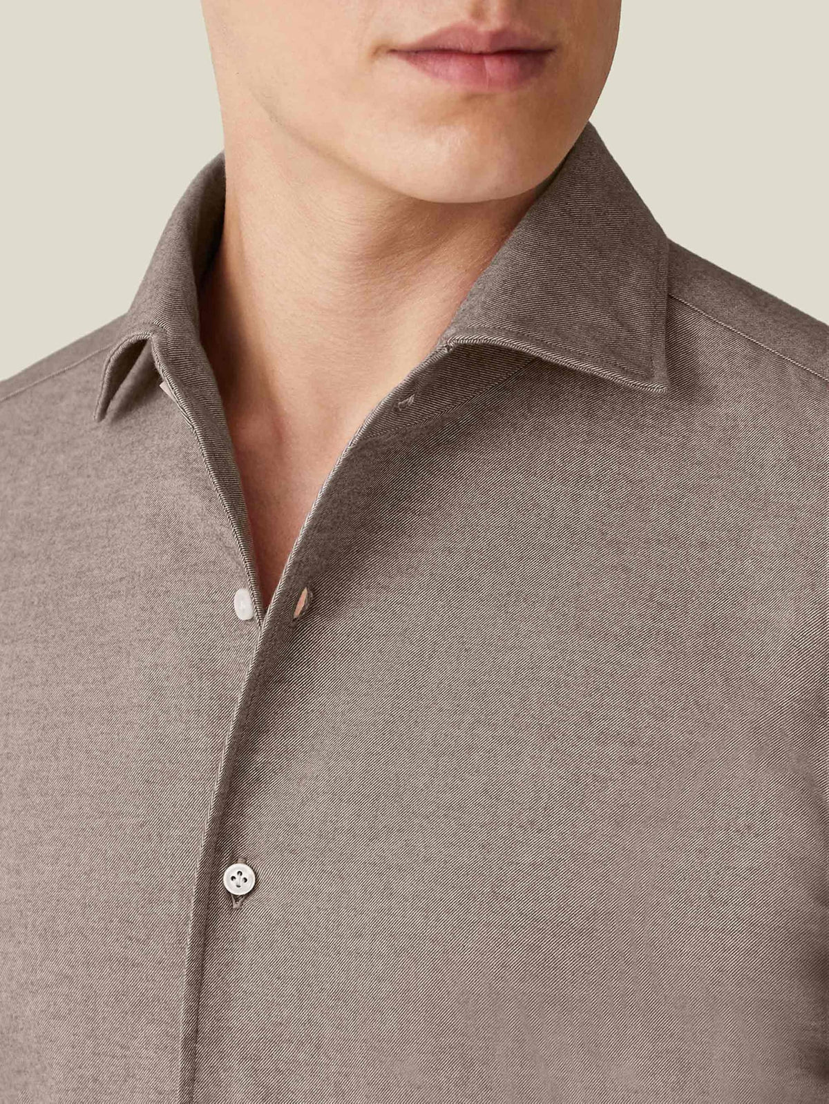 Close-up of a model wearing the Nocciola Brown Brushed Cotton Shirt, highlighting its signature one-piece collar.