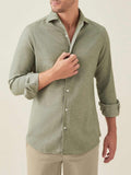 Front view of a model wearing the Luca Faloni Brushed Cotton Shirt in Moss Green with sleeves rolled up.