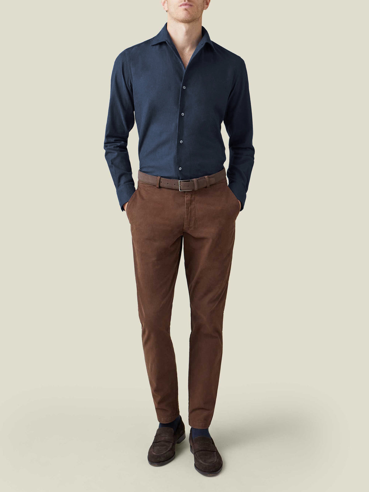 Front view of a model wearing the Luca Faloni Brushed Cotton Shirt in midnight blue, styled with brown trousers.