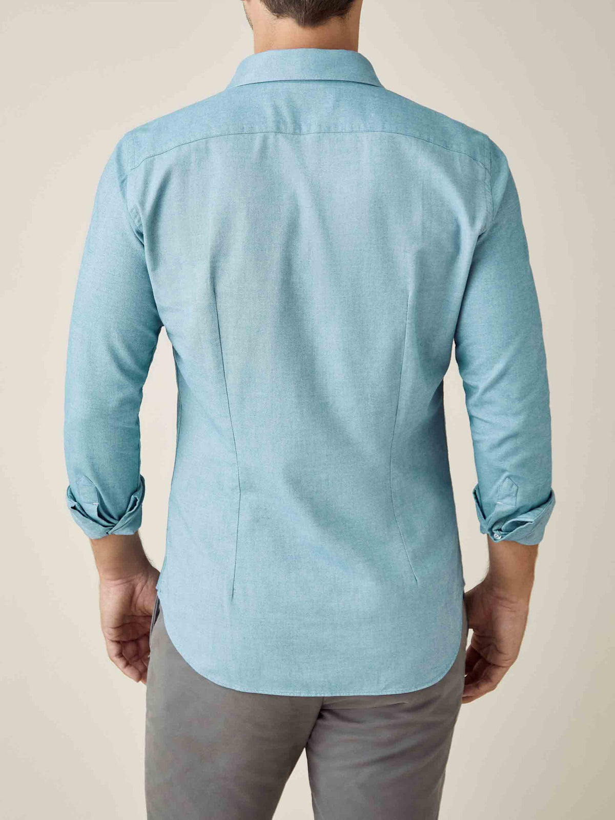 Back view of a model wearing the Luca Faloni Brushed Cotton Shirt in Topaz, showing the slim fit silhouette.