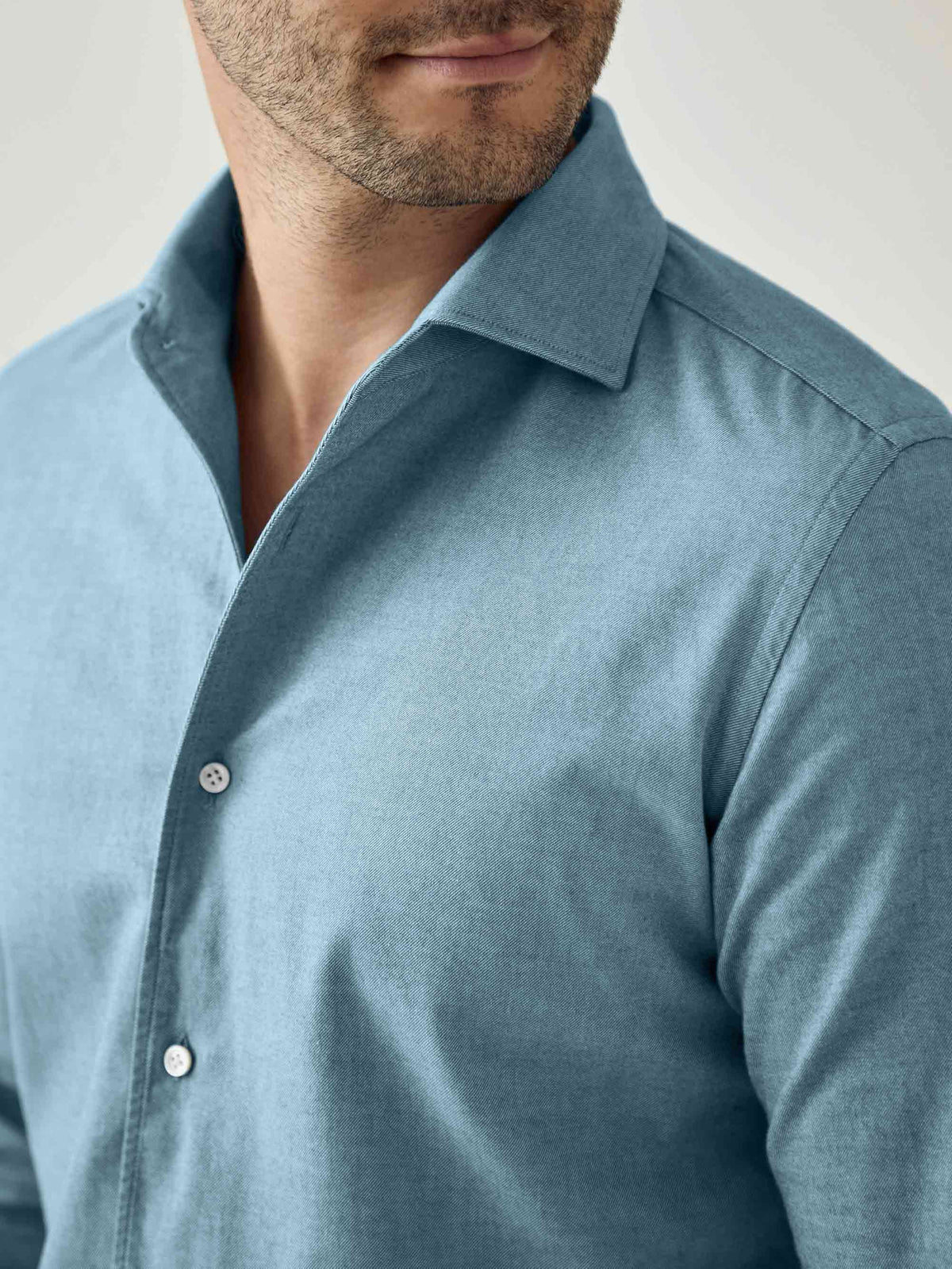 Close-up of the topaz blue Brushed Cotton Shirt, highlighting the one-piece collar and the soft, textured Italian fabric.