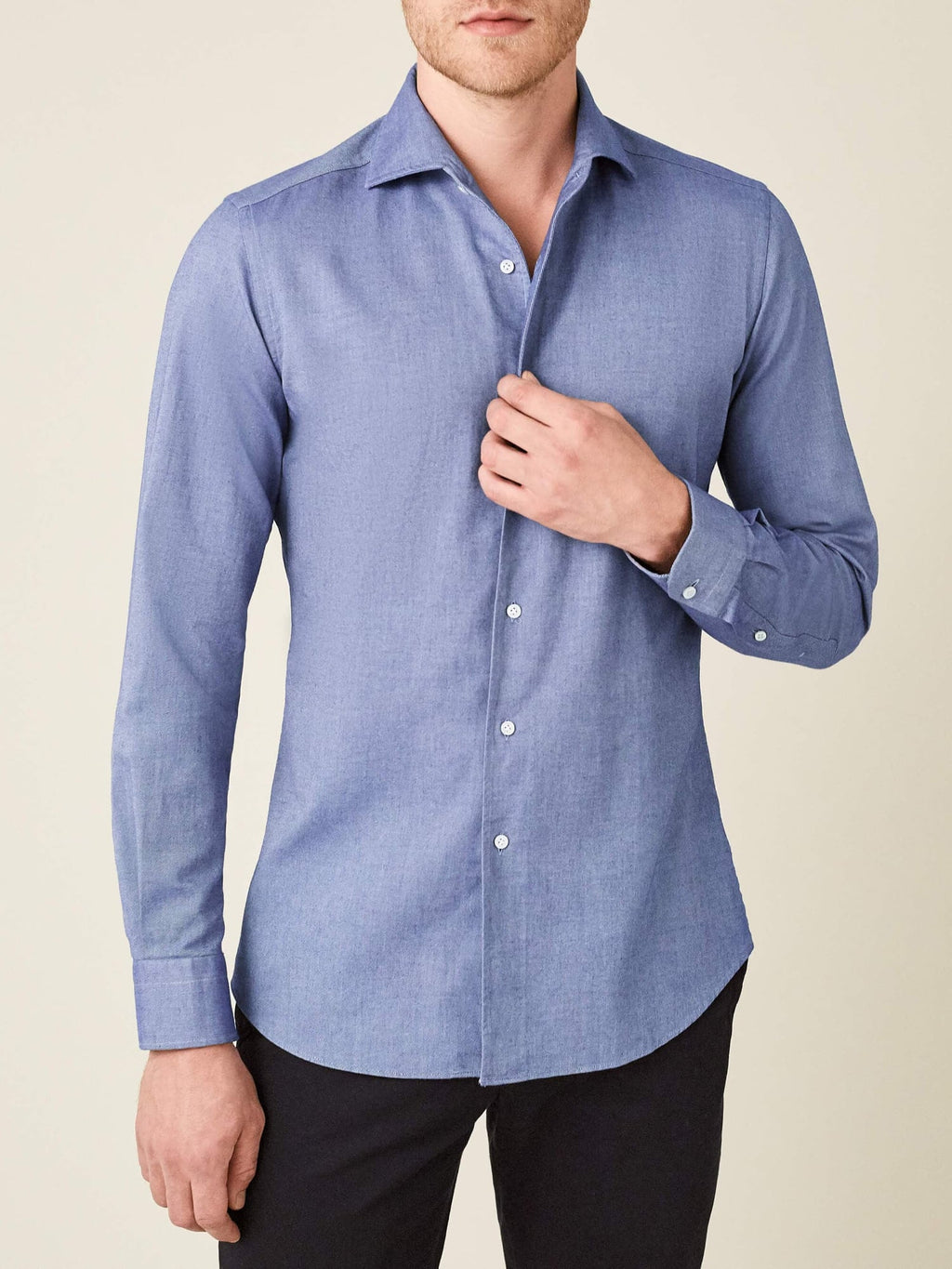 Front view of a man wearing the Luca Faloni Indigo Brushed Cotton Shirt, styled with dark trousers.