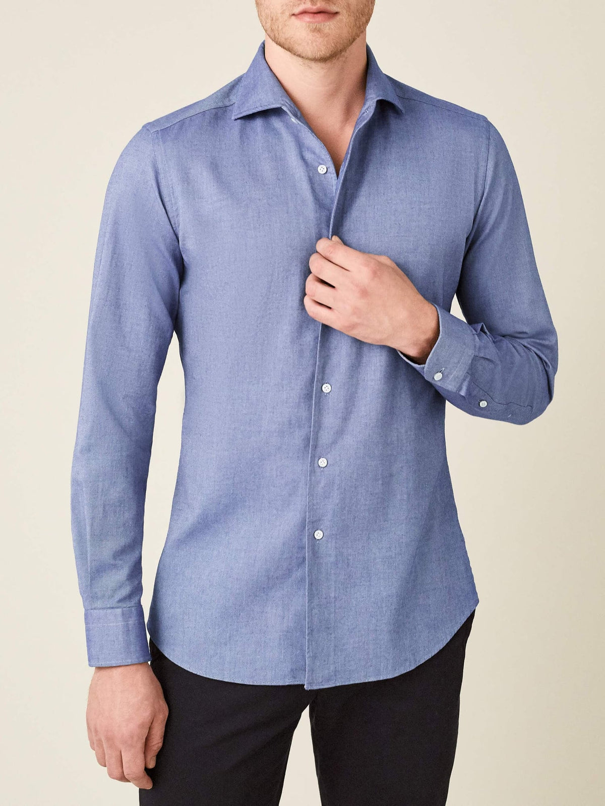 Front view of a man wearing the Luca Faloni Indigo Brushed Cotton Shirt, styled with dark trousers.