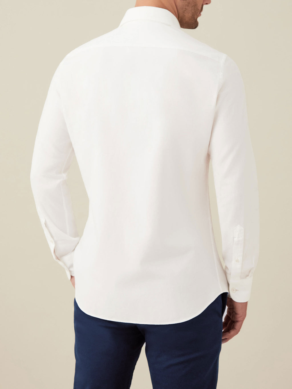 Back view of a model wearing the white Brushed Cotton Shirt, showing the fit and drape of the fabric.