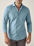 Model wears the Luca Faloni Brushed Cotton Shirt in Topaz. Front view with sleeves rolled up.