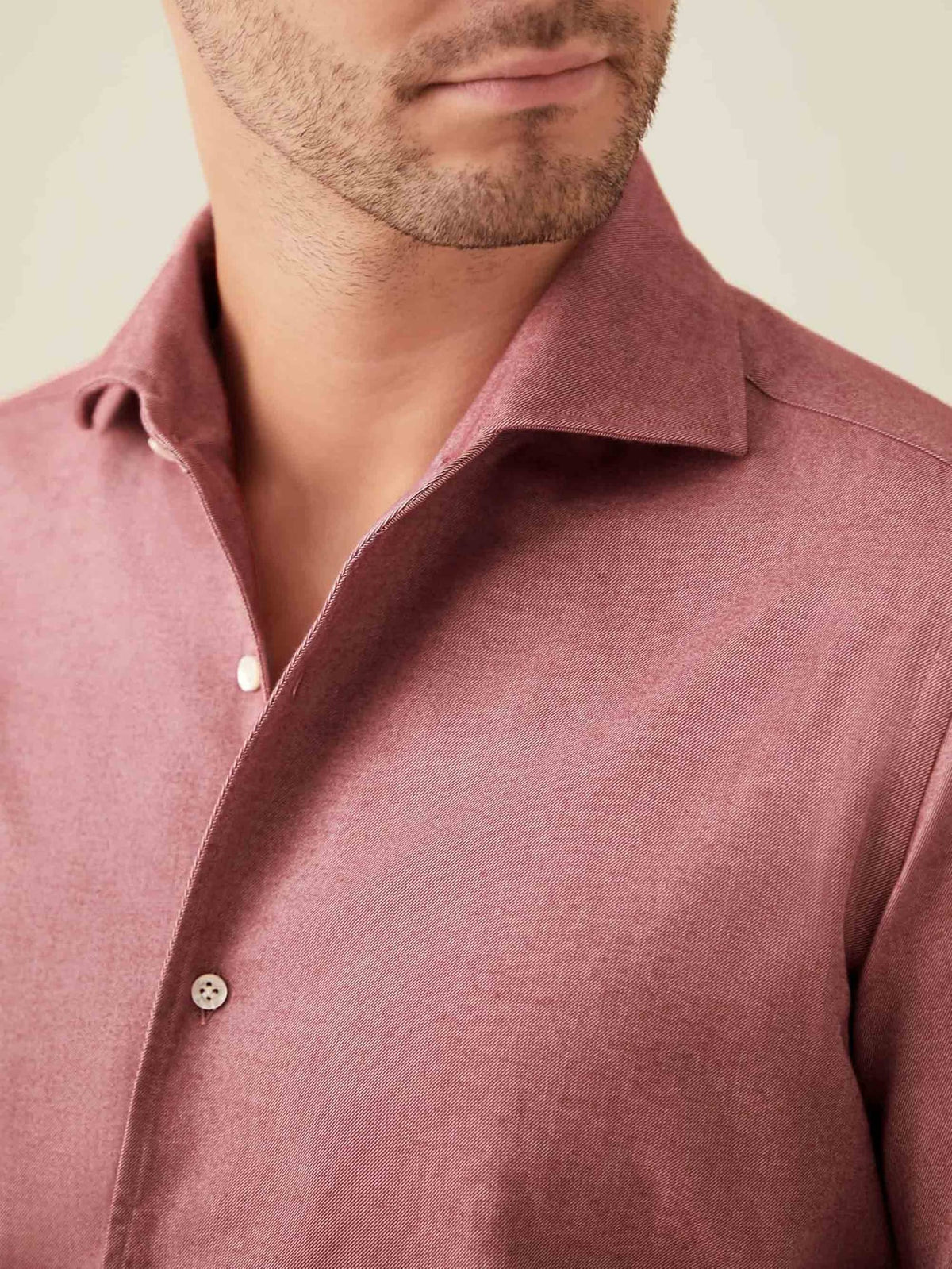 A detailed close-up of the Red Brushed Cotton Shirt, showcasing its signature one-piece collar and soft, silky texture.