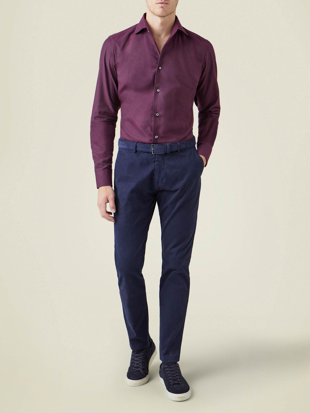 Model wears the Brushed Cotton Shirt in Burgundy, styled with navy trousers and sneakers.