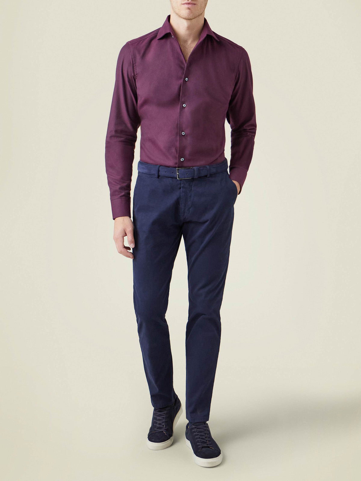 Model wears the Brushed Cotton Shirt in Burgundy, styled with navy trousers and sneakers.