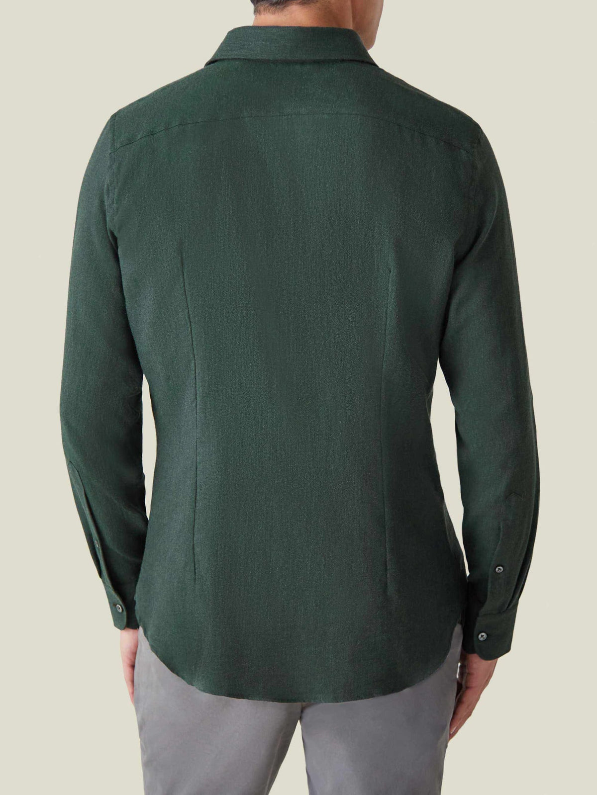 Back view of a model wearing the Forest Green Cashmere-Cotton Shirt, showing the tailored back darts and rounded hem.
