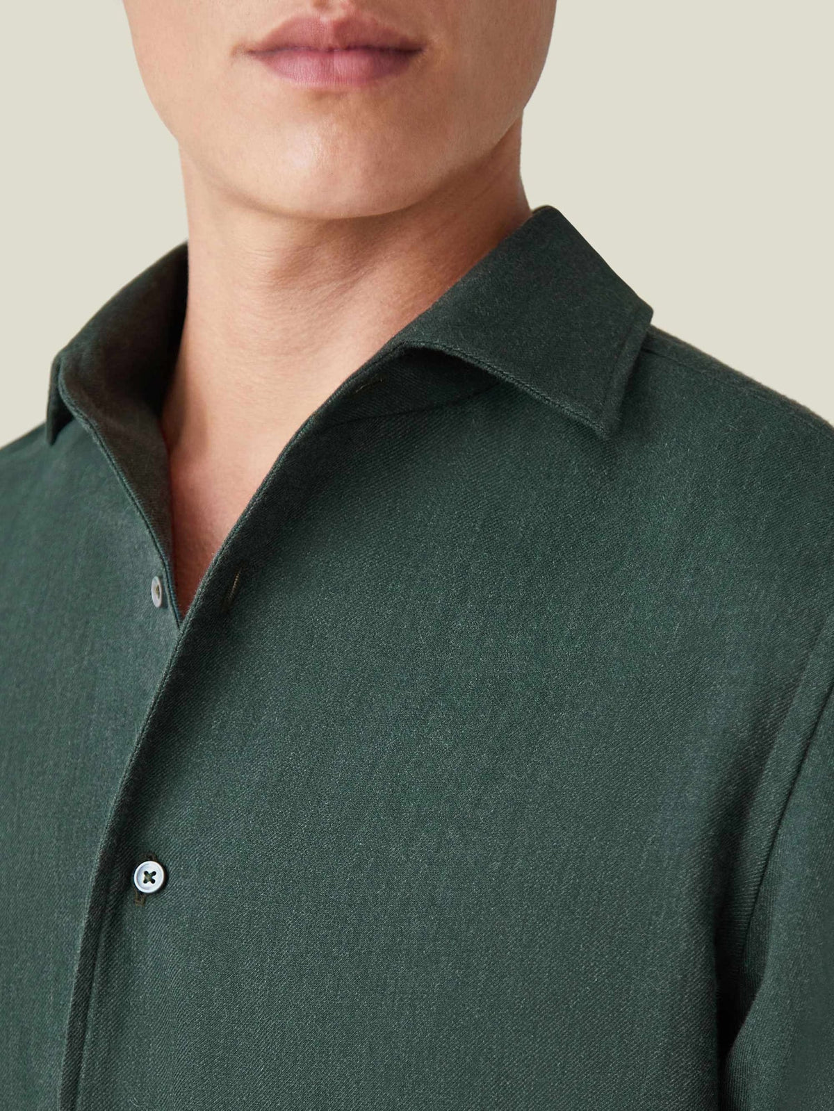 A close-up on the one-piece collar and soft mélange texture of the Forest Green Cashmere-Cotton Shirt.